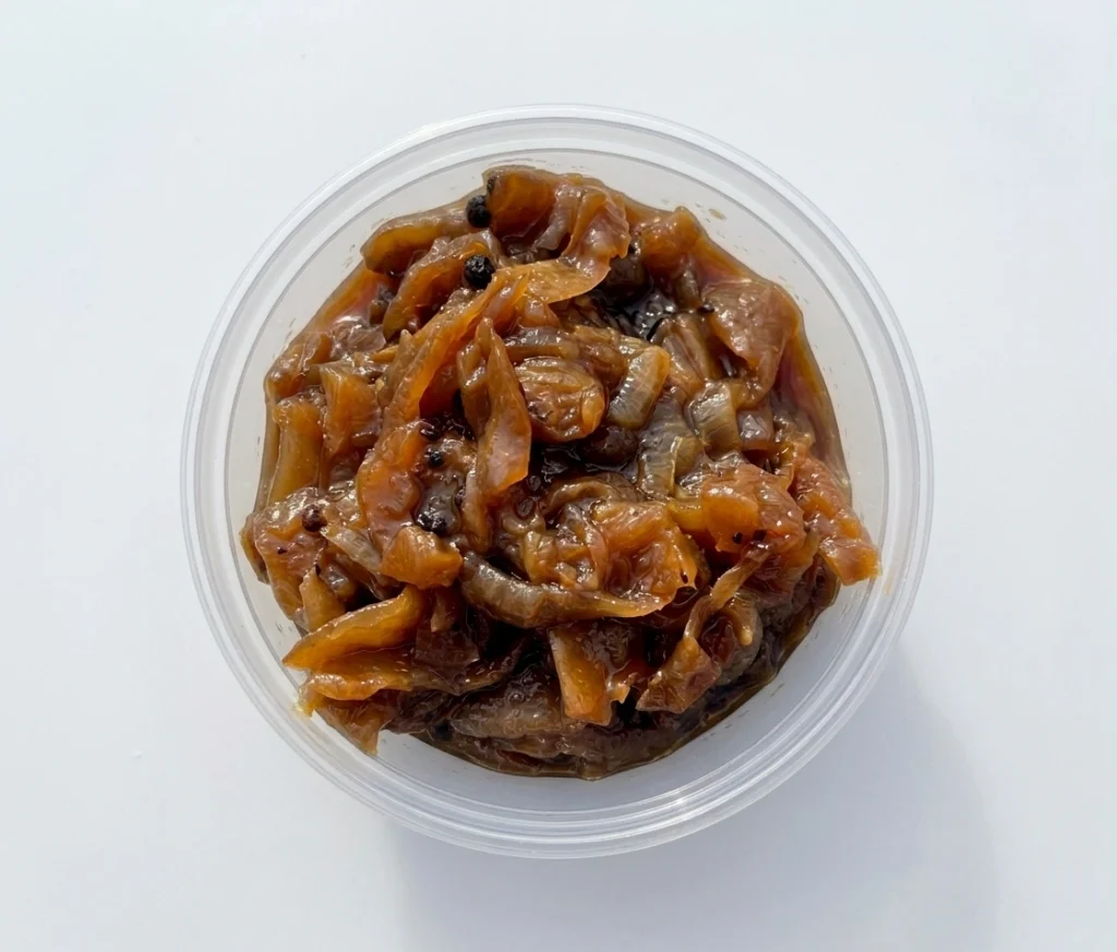 Smoked caramelized onion in a clear tub